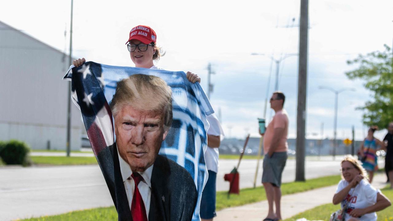 Supporters of Donald await his arrival at Milwaukee Mitchell International Airport. Picture: AFP