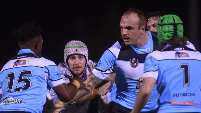 Sharks' Clinton Chettle offloads to Cooper Segeryaro during the Humpty Dumpty Foundation round of 2022 NRLNT season. Picture: (A)manda Parkinson