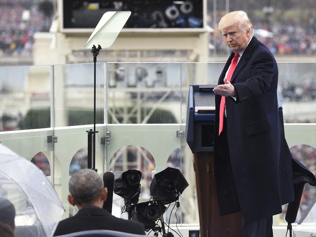 President Donald Trump thanks former President Barack Obama during the presidential inauguration on Capitol Hill in Washington on January 20, 2017. Picture: AP