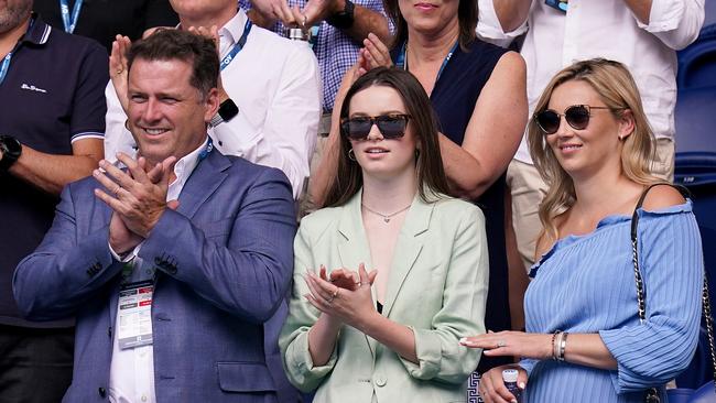 Karl Stefanovic with daughter Ava and wife Jasmine watching Ash Barty of Australia and Polona Hercog on day three of the Australian Open. Picture: AAP