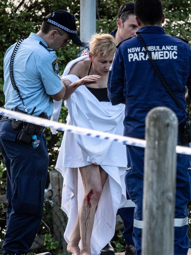 Yulia Ivanov is helped to an ambulance by paramedics. Picture: Monique Harmer