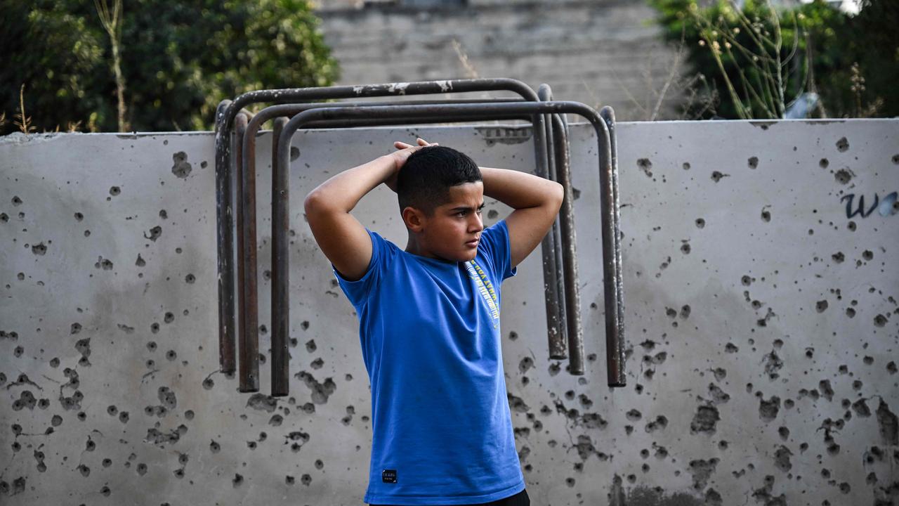 A Palestinian boy in Zababdeh, in the West Bank, following an Israeli raid. Picture: AFP