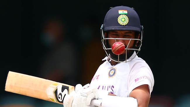 Cheteshwar Pujara contends with a bouncer from Pat Cummins on day five at the Gabba. Picture: AFP