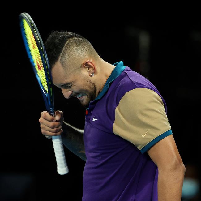 Nick Kyrgios smacks himself in the head with his racquet late in the fourth set. Picture: Michael Klein