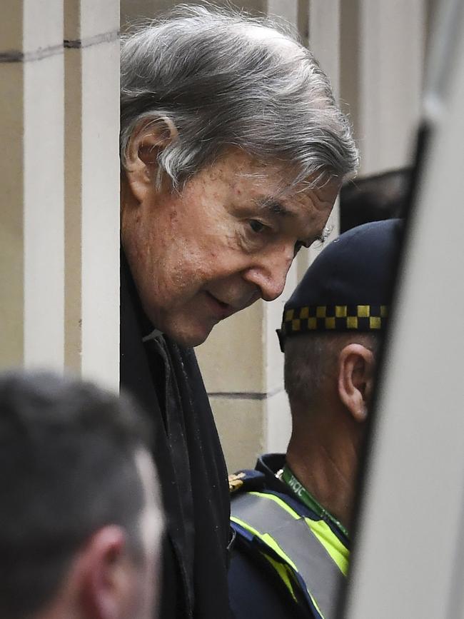 Pell being escorted from the Supreme Court during his trial. Picture: AFP