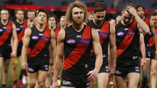 Essendon skipper Dyson Heppell leads his team off after one of the club’s dirtiest ever nights. Picture: Michael Klein