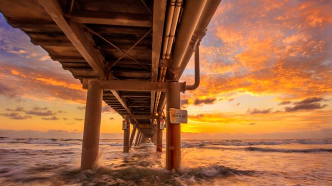 Sunrise at the sand pumping jetty, The Spit. Picture: Jules Ingall.