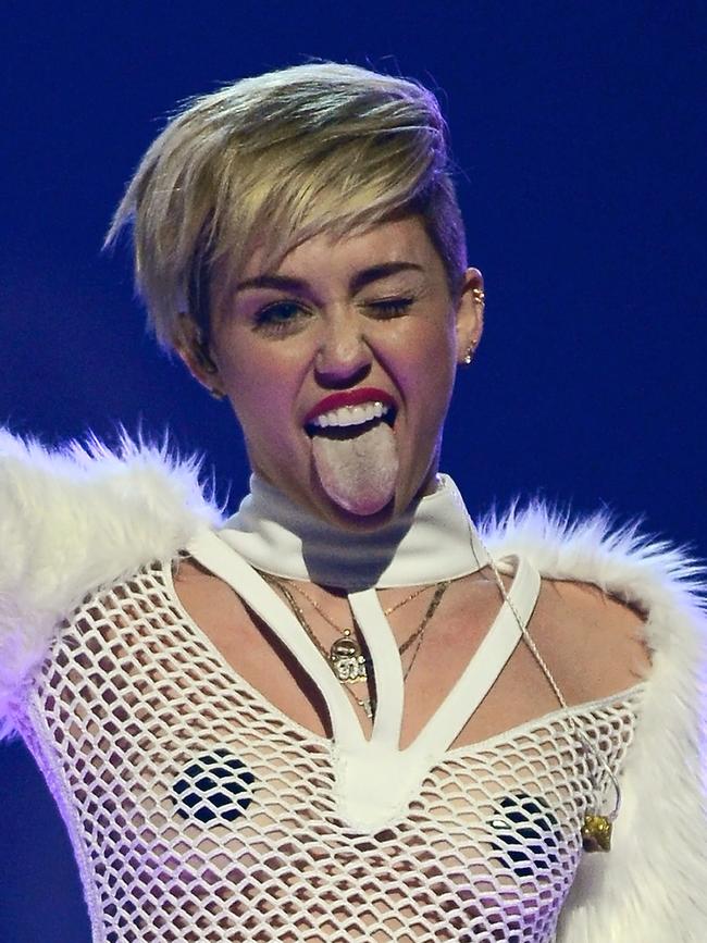 But it didn't keep the performer down for long! Miley Cyrus winks and sticks out her tongue as she performs during the iHeartRadio Music Festival. Picture: Getty