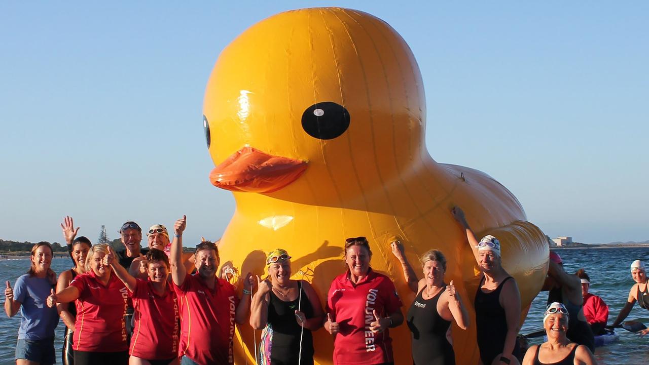 Daphne the giant inflatable duck with members of the Cockburn Masters Swimming Club. Picture: AFP