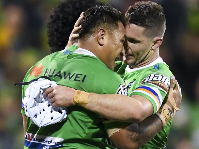 Josh Papalii of the Raiders (left) and Jarrod Croker of the Raiders celebrate after scoring a try during the NRL Preliminary Final match between the Canberra Raiders and South Sydney Rabbitohs at GIO Stadium in Canberra, Friday, September 27, 2019. (AAP Image/Lukas Coch) NO ARCHIVING, EDITORIAL USE ONLY