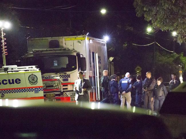 Federal police and NSW Police conduct a raid on Sproule Street in Lakemba last night. Picture: Damian Shaw