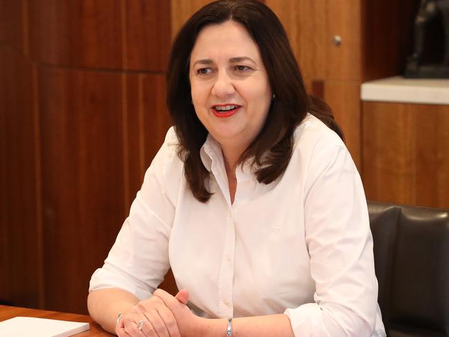 Premier Annastacia Palaszczuk with her shirt sleeves rolled up, back at work, 1 William Street, Brisbane. Photographer: Liam Kidston.