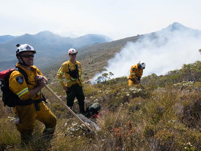 Tasmania Fire Service firefighters at the Gell River fire. Picture: WARREN FREY/TASMANIA FIRE SERVICE***MUST CREDIT BOTH WARREN FREY AND TASMANIA FIRE SERVICE***