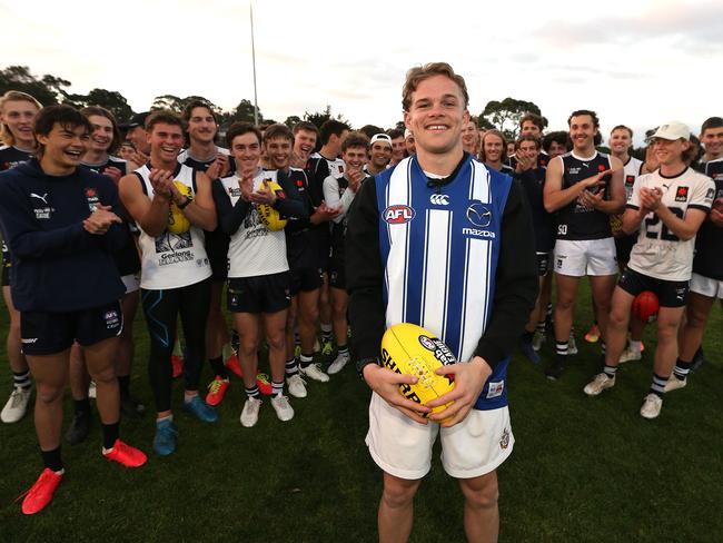 Charlie Ham is congratulated by Geelong Falcons teammates being drafted in 2021. Picture: Mike Dugdale