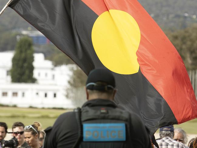 CANBERRA, AUSTRALIA-NCA NewsWire Photos SEPTEMBER 01 2020.A group of indigenous protestors protested at the doors to Parliament House Canberra.Daen-a Gamilario man from Walgett in NSW with the Aboriginal flag outside Parliament House during the protest.Picture: NCA NewsWire / Gary Ramage