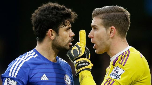 Chelsea's Diego Costa, left, argues with West Ham United's goalkeeper Adrian during the English Premier League soccer match between Chelsea and West Ham at Stamford Bridge stadium in London, Friday, Dec. 26, 2014. (AP Photo/Matt Dunham)