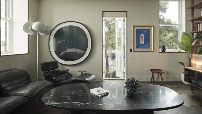 In Naomi Tosic’s living room sits a circular framed work by Bill Henson, a Charles Blackman piece is hung to the right, and the sculpture on table is a work from Del Kathryn Barton. Picture: Dave Wheeler