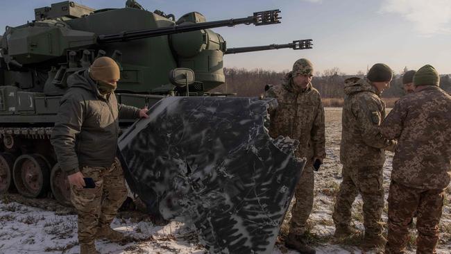 A Ukrainian drone hunting team show the media a part of an allegedly downed Russian drone, in the outskirts of Kyiv, on November 30, 2023, Picture: AFP