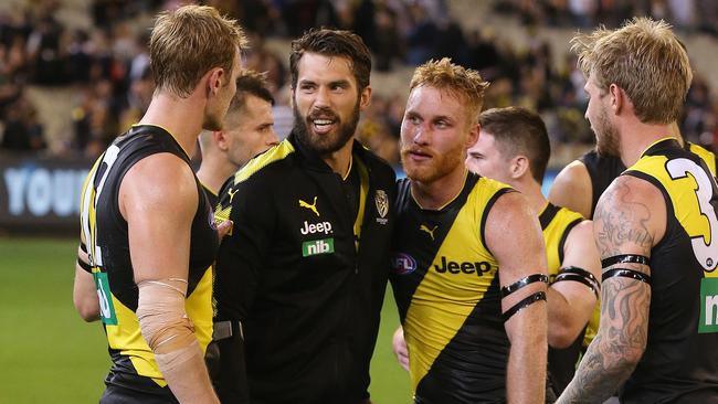 Alex Rance is consoled by teammates after last night’s game. Picture: Michael Klein