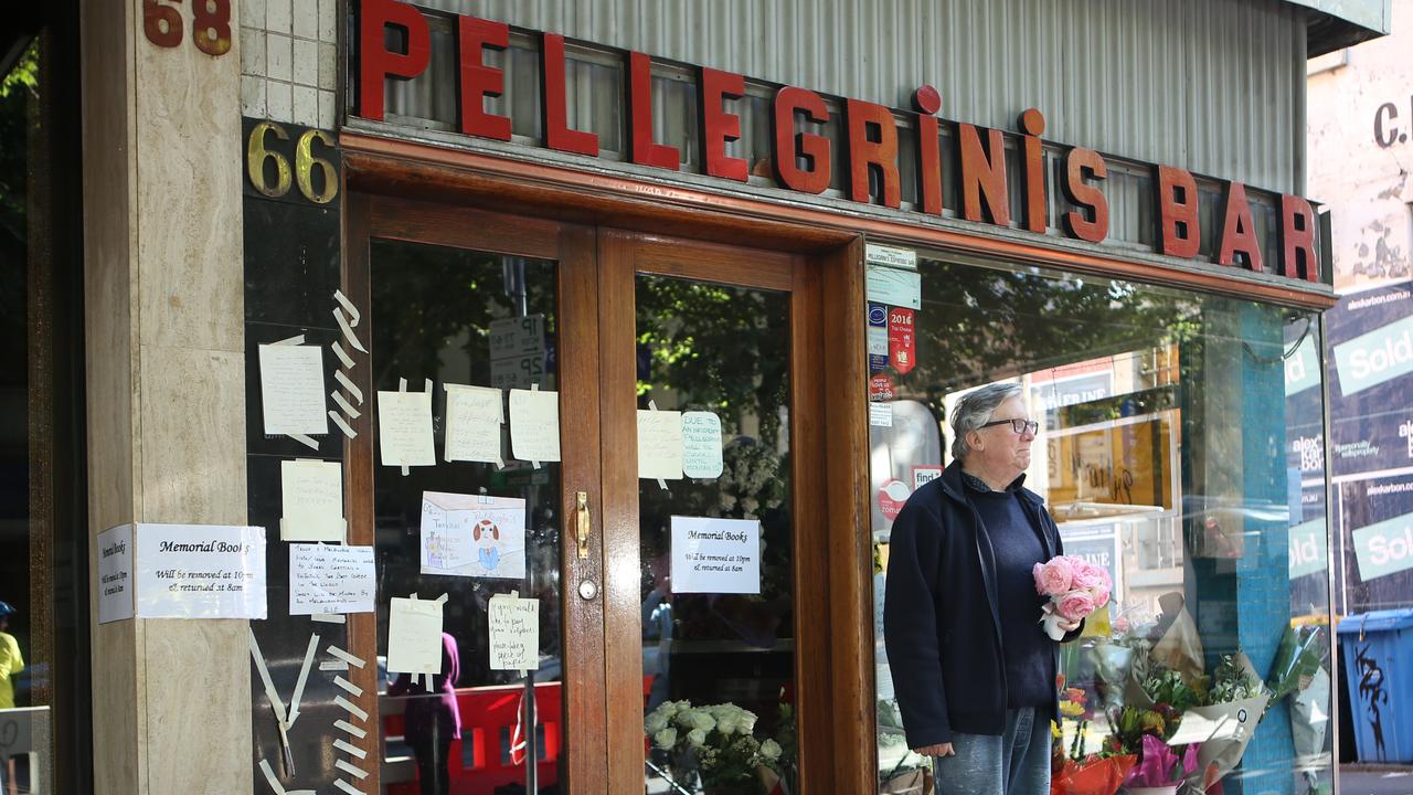 A man arrives with flowers this morning. Picture: David Crosling