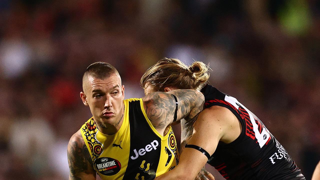 DARWIN, AUSTRALIA – AUGUST 22: Dustin Martin of the Tigers is challenged by Mason Redman of the Bombers during the round 13 AFL match between the Essendon Bombers and the Richmond Tigers at TIO Stadium on August 22, 2020 in Darwin, Australia. (Photo by Daniel Kalisz/Getty Images)