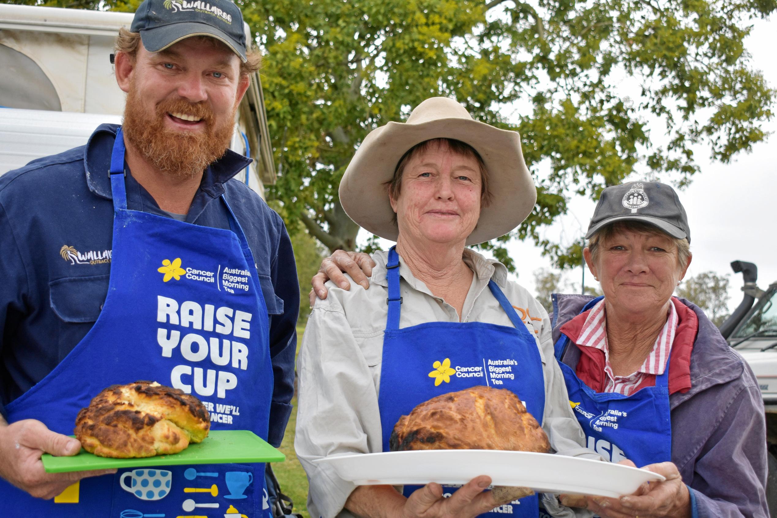 Justin MacDonnell, Lynne Jones and Lib McEwan with their damper at Injune's Biggest Morning Tea. Picture: Ellen Ransley