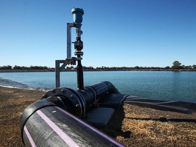 A pipe runs into a holding pond at the Santos Ltd. Leewood water treatment facility in Narrabri, Australia, on Thursday, May 25, 2017. A decade after the shale revolution transformed the U.S. energy landscape, Australia  poised to overtake Qatar as the worlds biggest exporter of liquefied natural gas  is experiencing its own quandary over natural gas. Photographer: Brendon Thorne/Bloomberg via Getty Images