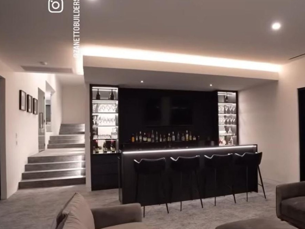 Clint showed off his home, complete with built-in bar, on Instagram last year.