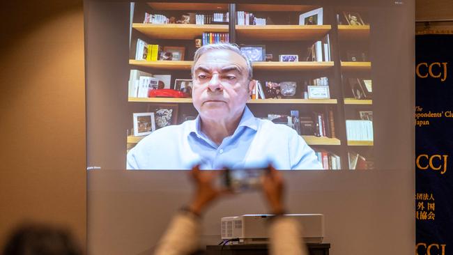 Former chairman of Nissan addressing reporters in Tokyo overnight from Lebanon. Picture: Philip Fong/AFP