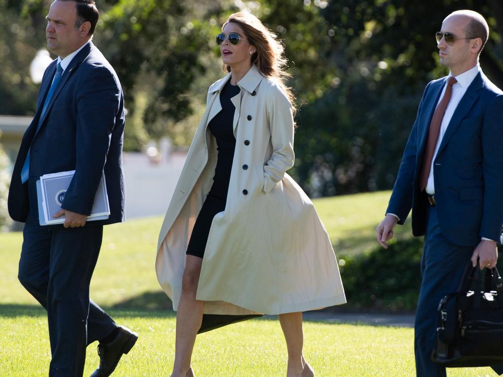 Hope Hicks, centre, with Dan Scavino and Stephen Miller walk to Marine One earlier this year. Picture: SAUL LOEB / AFP.