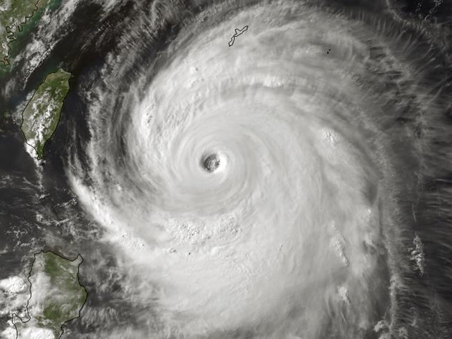 This National Oceanic and Atmospheric Administration (NOAA) satellite image obtained July 8, 2014 and taken by MTSAT-2 at 0730Z on July 7, 2014 shows Super Typhoon Neoguri located south-southwest of Kadena Air Base, Okinawa. Powerful typhoon Neoguri lashed Japan's southern Okinawa islands Tuesday, as over half a million people were forced to seek shelter, with the region's worst storm in years downing trees and bringing air and sea traffic to a halt. The typhoon packed gusts of up to 216 kilometres (134 miles) per hour with torrential downpours, forcing the cancellation of hundreds of flights as authorities said at least one person had died and several were injured by the raging storm. AFP PHOTO/NOAA/HANDOUT = RESTRICTED TO EDITORIAL USE - MANDATORY CREDIT "AFP PHOTO /NOAA/ HANDOUT" - NO MARKETING NO ADVERTISING CAMPAIGNS - NO A LA CARTE SALES/DISTRIBUTED AS A SERVICE TO CLIENTS =