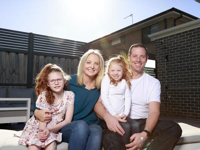 NETWORK. MAY 20, 2023. Pictured at home in Box Hill today is Michael Desmyth with wife Jordana, and their daughters Skylar 8 and Indiana 5, for a story on Solar power. Picture: Tim Hunter.