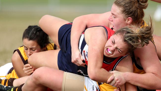 Box Hill’s Tamara Luke tackles Darebin’s Ebony Marinoff. Picture: Mark Dadswell