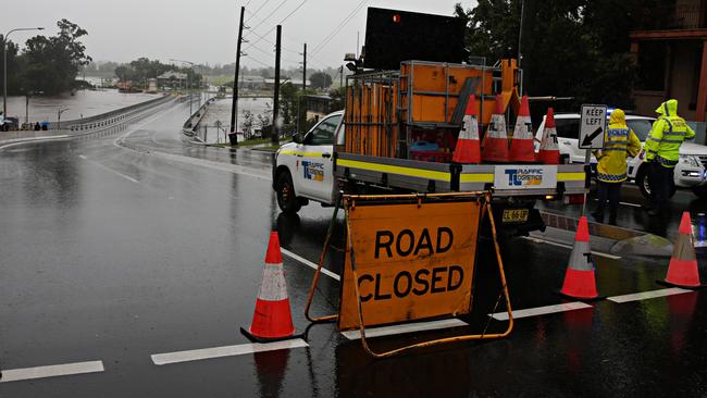 … and crews on the other side of the bridge. Picture: Adam Yip