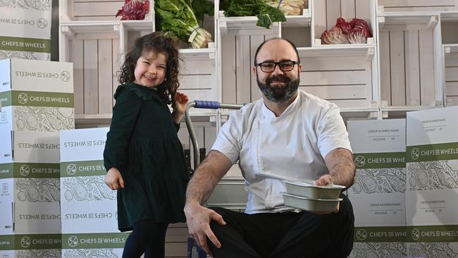 Chefs on Wheels founder Paul Baker with his daughter Margot, 4, with some of the meals. Paul says orders have been going through the roof in lockdown, especially from those in quarantine. Picture: Keryn Stevens.