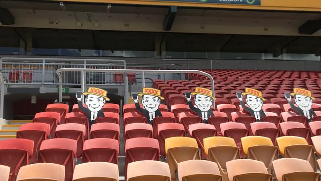 Mr Fourex cheers on the Broncos at an otherwise empty Suncorp Stadium.