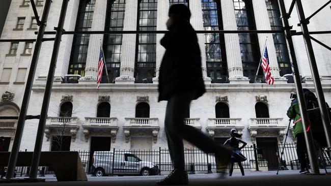 People walk by the New York Stock Exchange in the Financial District in Manhattan. Picture: AFP