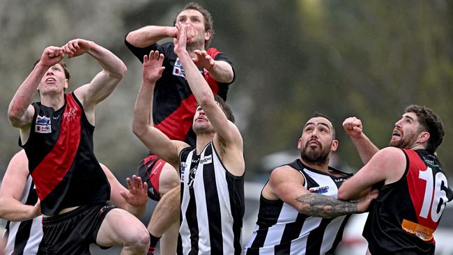 Riddell and Wallan players fly for the ball. Picture: Andy Brownbill