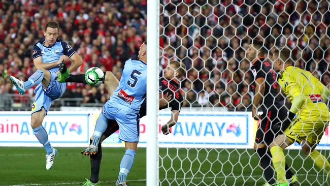 Per Mertesacker of Arsenal scores.