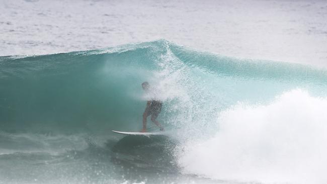 Surfers at Snapper Rocks and Kirra riding the Large swell produced by Cyclone OMA. Photograph : Jason O'Brien