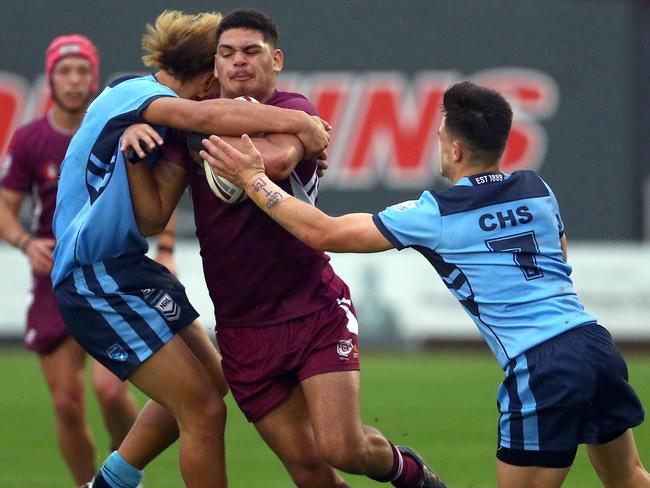 Action from the Australian state schools national rugby league championship match between Queensland Maroon and NSW CHS. QLDÃs Lui Lee attacks. Picture: Tertius Pickard