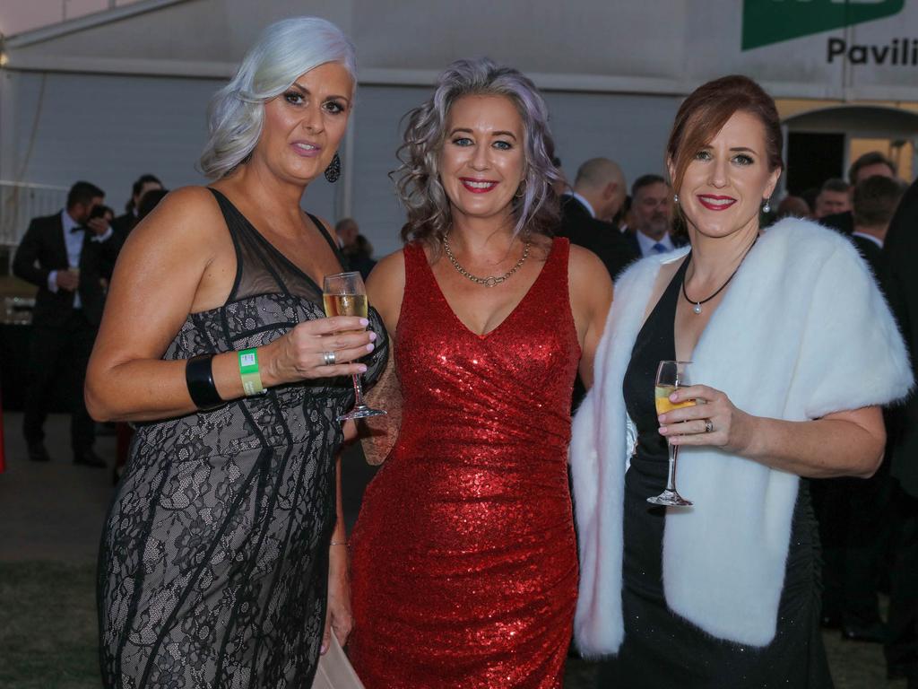 Kylie Alrecht, Kirrily Freon and Megan Donohoe at the Darwin Turf Club Gala Ball. Picture: Glenn Campbell