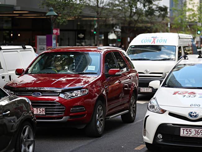 Various transport options clog Albert St in Brisbane’s CBD. Picture: Annette Dew