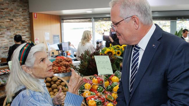 A woman gives Scott Morrison the thumbs up as he visits Palamara Village Fruits in Mount Eliza, Victoria. Picture: Jason Edwards