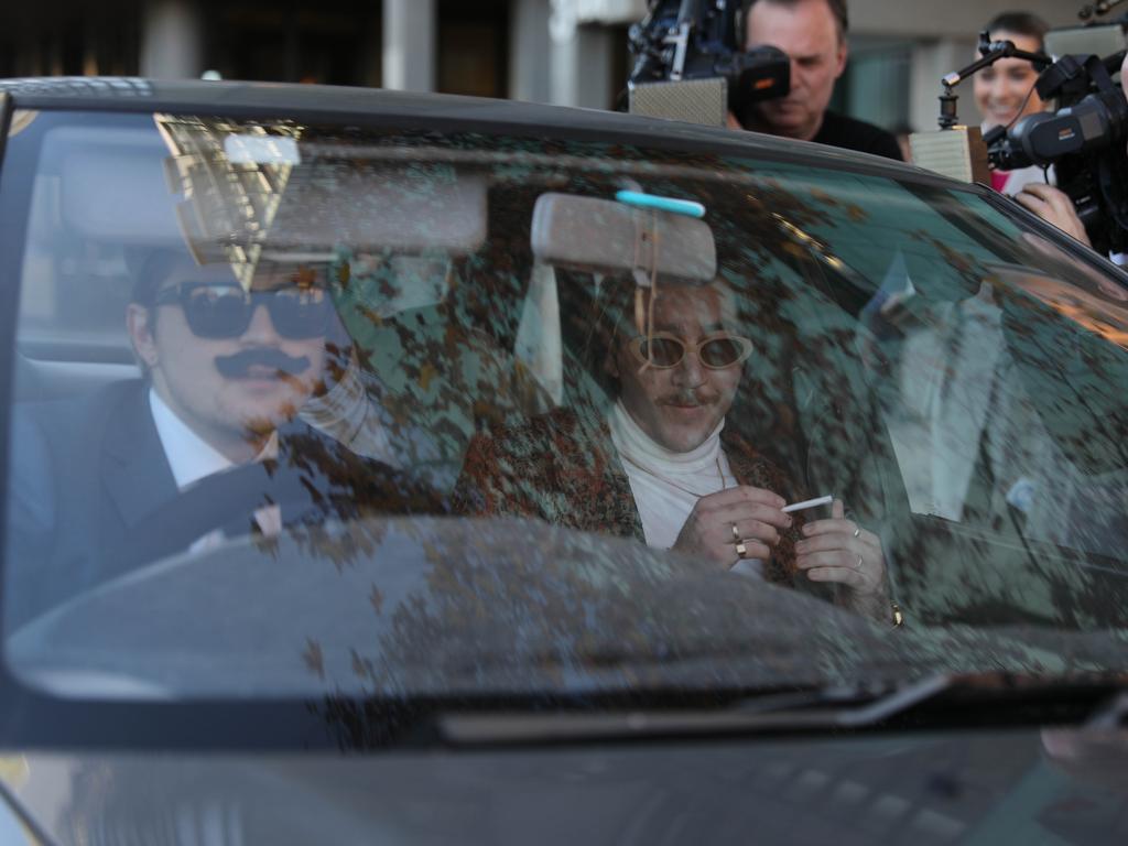 They were greeted by a “limo” driver with a fake moustache who couldn’t reverse the car away from the courthouse. Picture: NCA NewsWire / Dean Martin