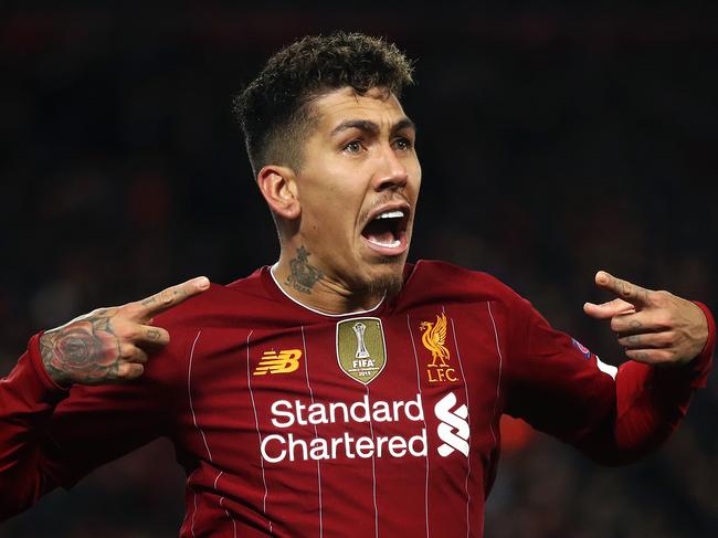 LIVERPOOL, ENGLAND - MARCH 11: Roberto Firmino of Liverpool celebrates after scoring his team's second goal during the UEFA Champions League round of 16 second leg match between Liverpool FC and Atletico Madrid at Anfield on March 11, 2020 in Liverpool, United Kingdom. (Photo by Julian Finney/Getty Images)