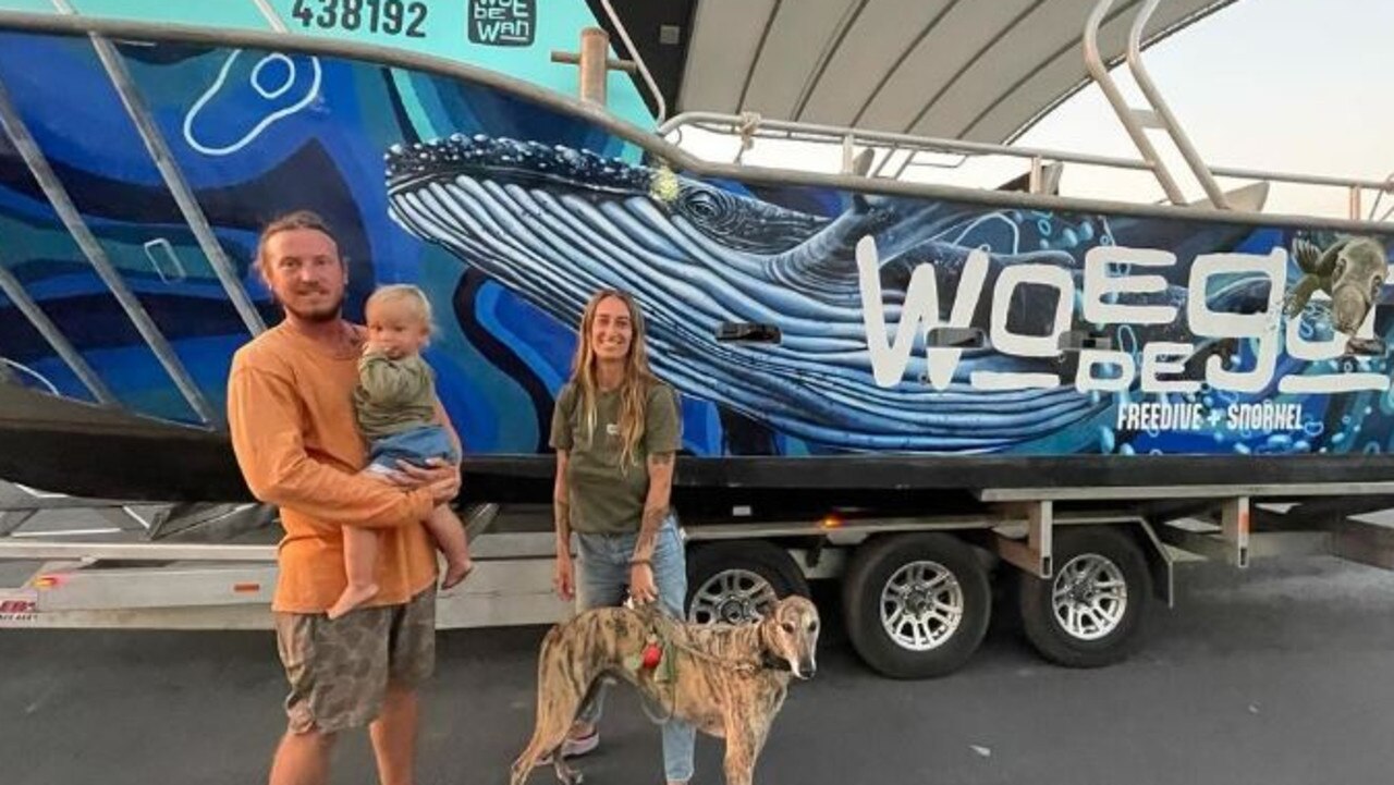 Dylan with his son Leon, and Lara stand alongside their boat, Woebegone.