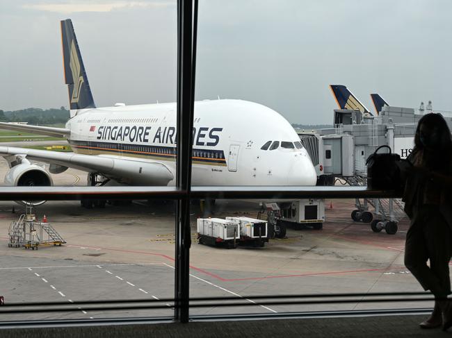 A Singapore Airlines Airbus A380 plane is seen parked on the tarmac at Changi International Airport in Singapore on October 24, 2020. (Photo by ROSLAN RAHMAN / AFP)