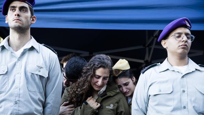 Family and friends mourn at a funeral service for Captain Arnon Moshe Avraham Benvenisti Vaspi in Rosh Pinna, Israel, on Tuesday. Picture: Getty Images