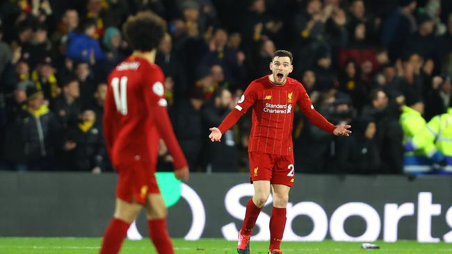 Liverpool’s Andy Robertson and teammate Mohamed Salah after conceding the third goal during the Premier League match between Watford FC and Liverpool FC at Vicarage Road.